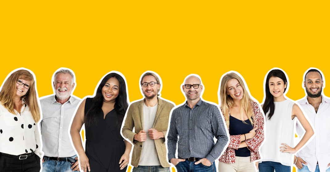Diverse group of eight people standing in a row against a yellow background, with faces blurred and outlined in white.